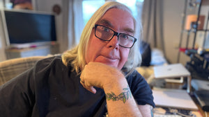 john ogden sitting at his desk looking out at the viewer