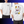 White t-shirt with a cartoon cat design of a chinese lucky cat on the back, worn by a person.