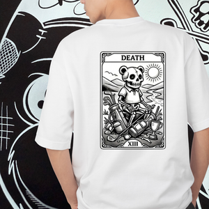 White t-shirt with a graphic design of a skeleton panda bear on the back, resembling the Death card from a tarot deck, against a black and white abstract background.