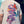 Person wearing a t-shirt with butterfly design and 'Handle with Care' text.