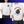 White t-shirt with a cartoon bomb design on the front and back, featuring text handle with care.