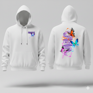 White hoodie with colorful butterfly designs and the wording handle with care, on front and back on a gray background