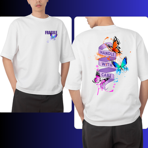 White t-shirt with colorful butterfly graphics and text on front and back, worn by a person.
