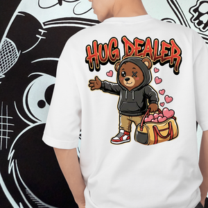 White t-shirt with a bear graphic and 'Hug Dealer' text on the back, against a black and white abstract background.