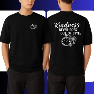 Black t-shirt with a design and kindness goes out of style text on the front and back worn by a person.
