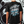 Black t-shirt with graphic design saying life, you got this and text on the back, worn by a person.