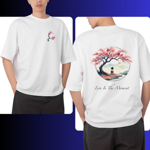 White t-shirt with cherry blossom tree design on front and back, worn by a person.
