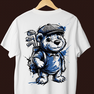 White t-shirt with a bear holding golf clubs graphic on a hanger against a dark background